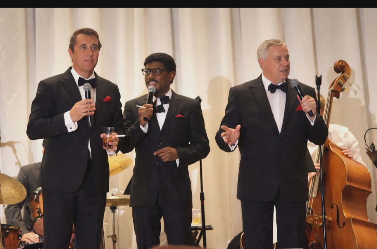 Joey Chiarenza performing as Frank Sinatra alongside Dean Martin and Sammy Davis Jr. tributes with a live orchestra